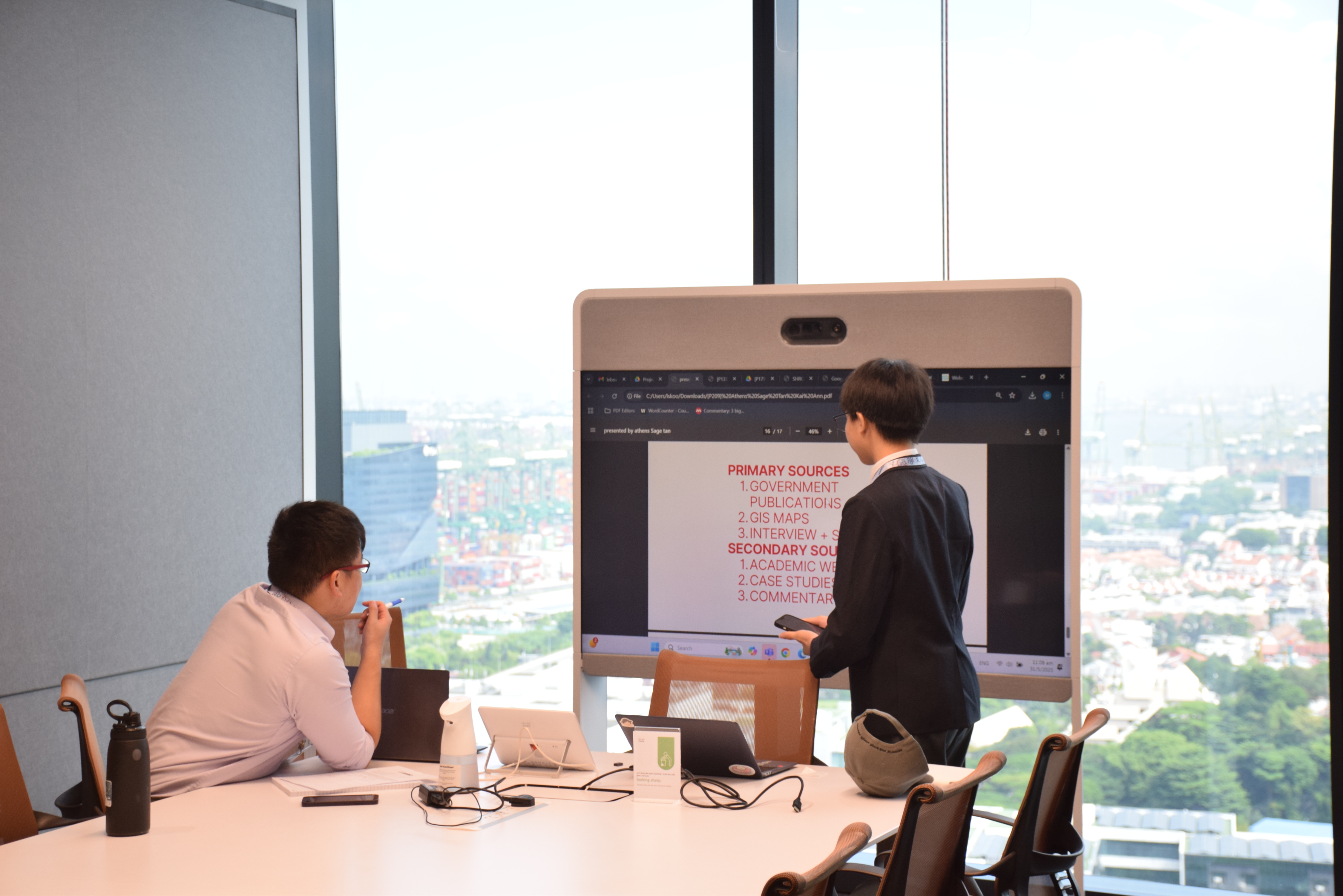 A student pitching to a mentor