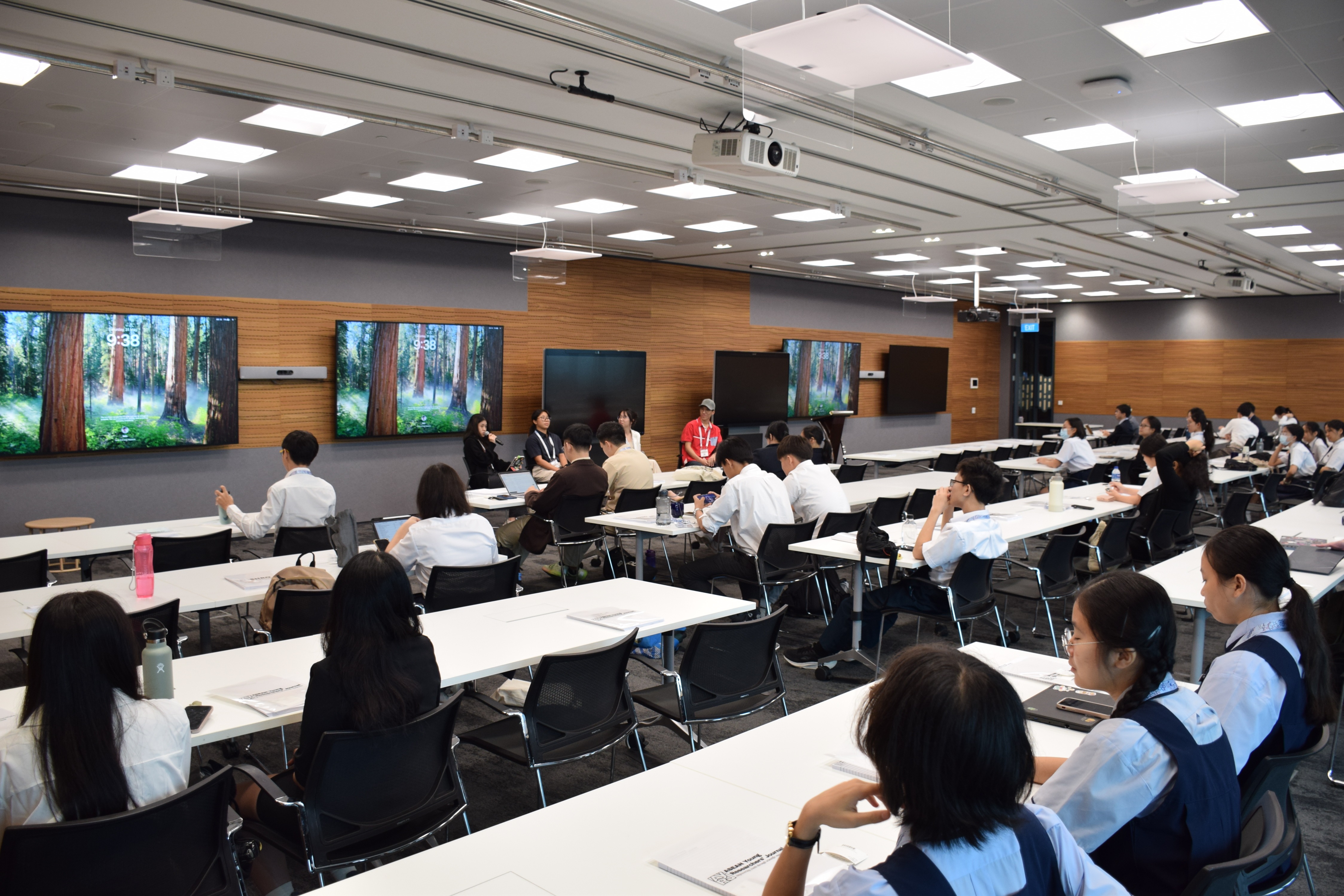 Students listening to a panel discussion